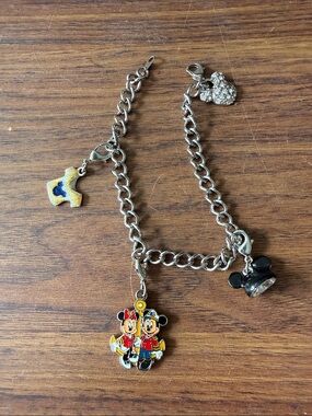 Disney Silver Tone Bracelet with 4 Detachable Signed Charms.